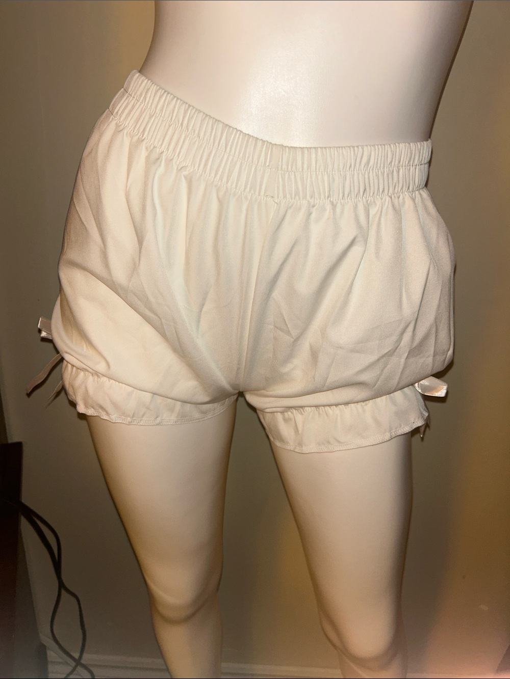 Women's Cream Elastic Waist Ruffle Hem Shorts